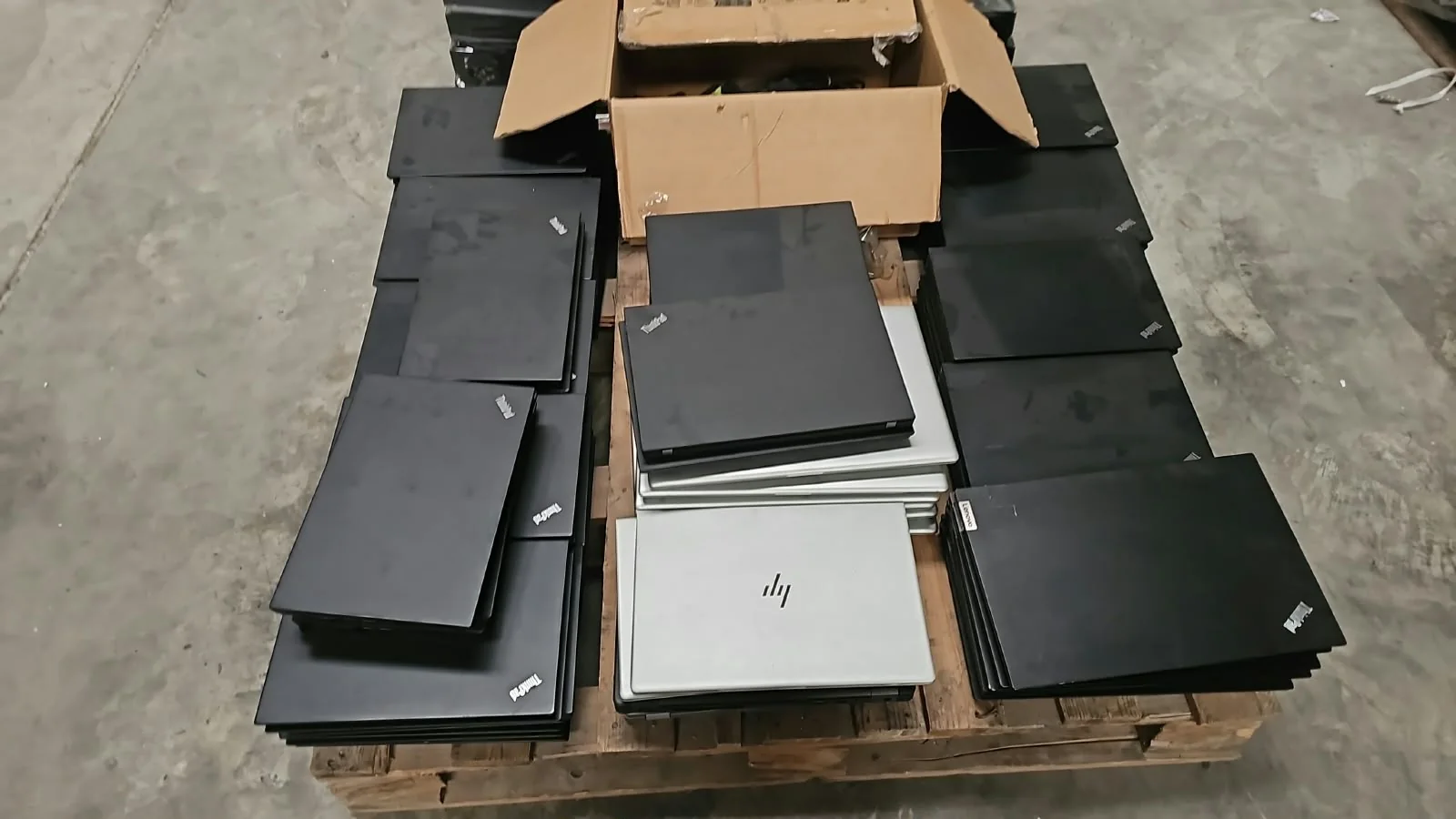 Pallet of used Lenovo ThinkPad and HP laptops in the Dar Al Qaraien warehouse